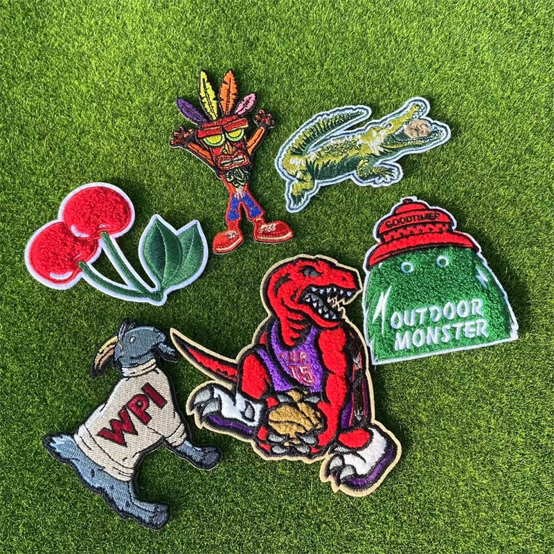 Chenille patches in various designs placed on the grass